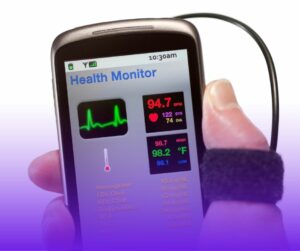 Person holding a phone displaying an health monitor app