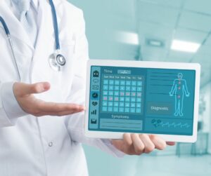 healthcare professional holding a tablet with patient info